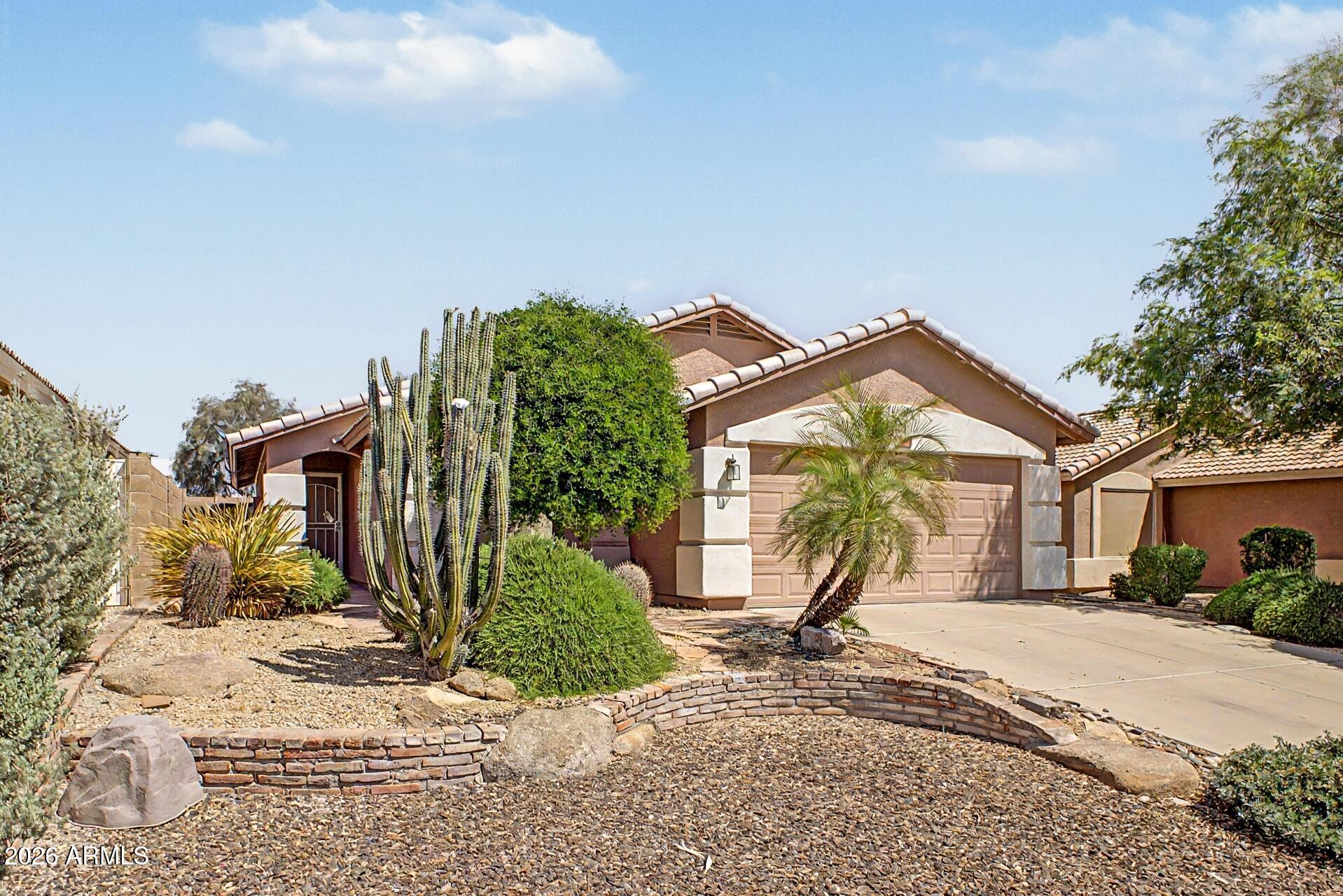 3691 South Conestoga Road Apache Junction, AZ 85119 - Photo 3 of 31 a view of a house with a yard and plant