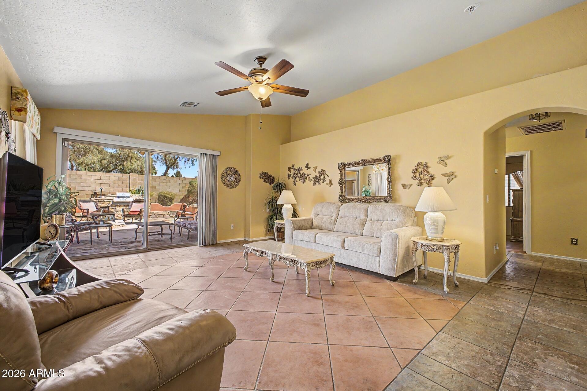 3691 South Conestoga Road Apache Junction, AZ 85119 - Photo 7 of 31 a living room with furniture and a flat screen tv