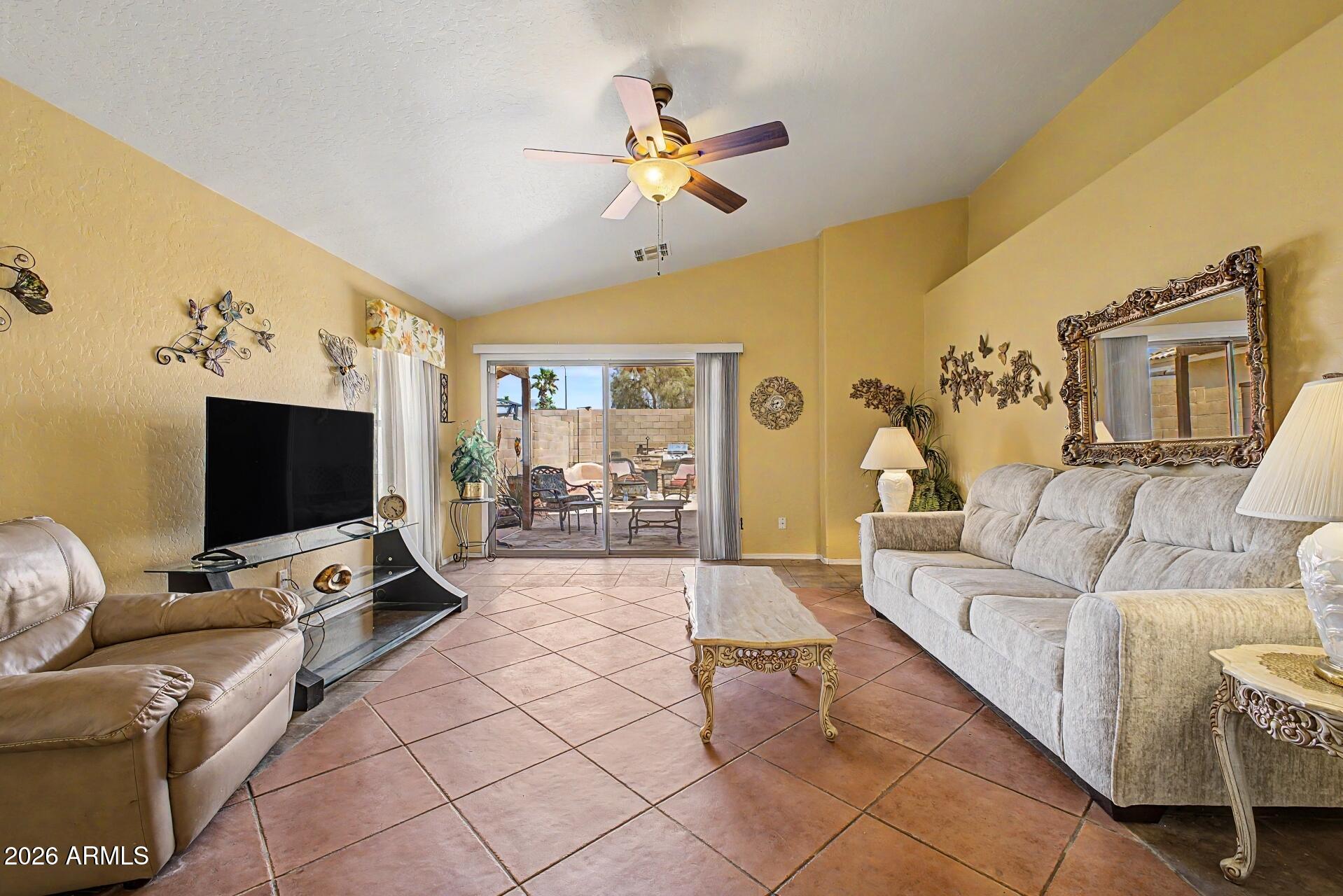 3691 South Conestoga Road Apache Junction, AZ 85119 - Photo 8 of 31 a living room with furniture and a flat screen tv