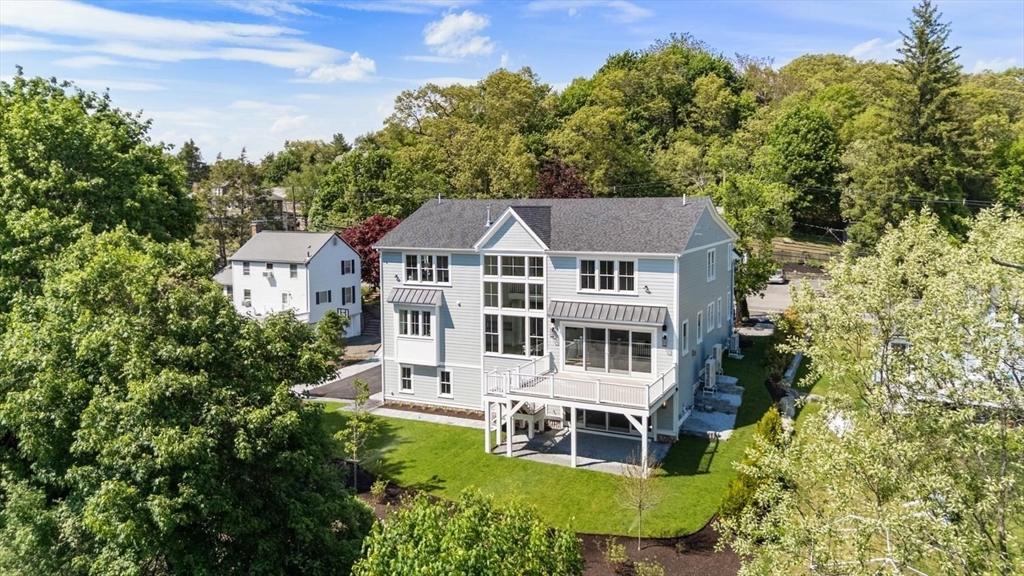 320 Concord Avenue Lexington, MA 02421 - Photo 36 of 40 an aerial view of a house with a yard and potted plants