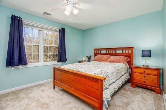 1 B Patriots Way, Unit B Sterling, MA 01564 - Photo 21 of 32 a bedroom with a bed and window