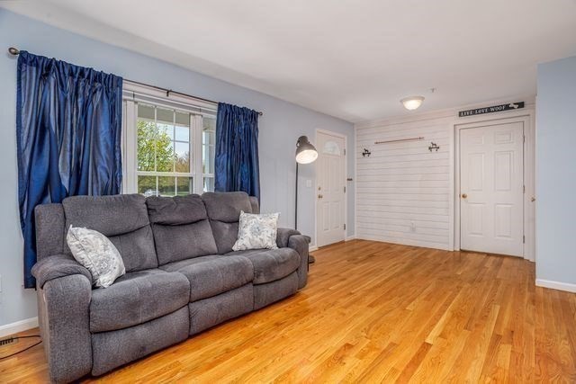 1 B Patriots Way, Unit B Sterling, MA 01564 - Photo 5 of 32 a living room with a couch and a dresser
