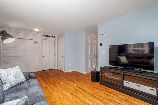 1 B Patriots Way, Unit B Sterling, MA 01564 - Photo 6 of 32 a bedroom with bed and flat screen tv