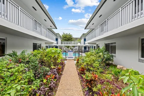 a view of a pathway with house on both side