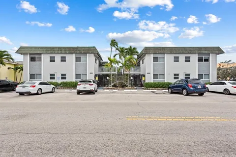 a group of cars parked in front of a building
