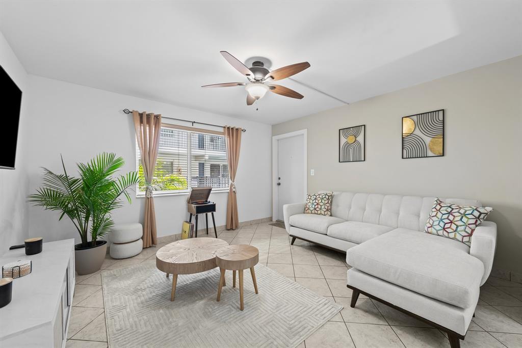1000 Southeast 15th Street, Unit 103 Fort Lauderdale, FL 33316 - Photo 3 of 15 a living room with furniture potted plant and window