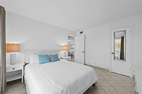 a bedroom with a bed and a closet