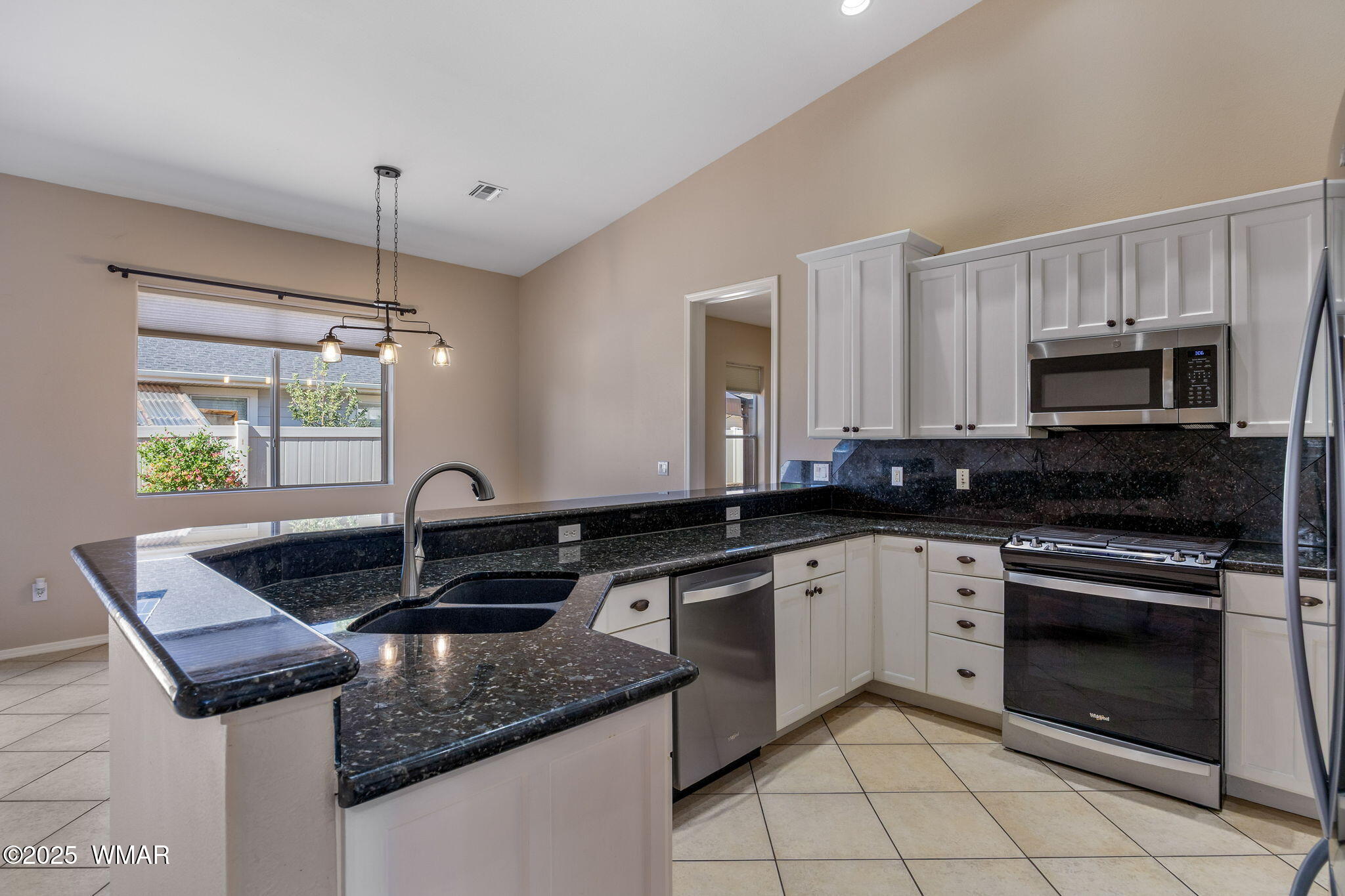 1058 East Adams Street Snowflake, AZ 85937 - Photo 5 of 37 a kitchen with a sink stove and microwave