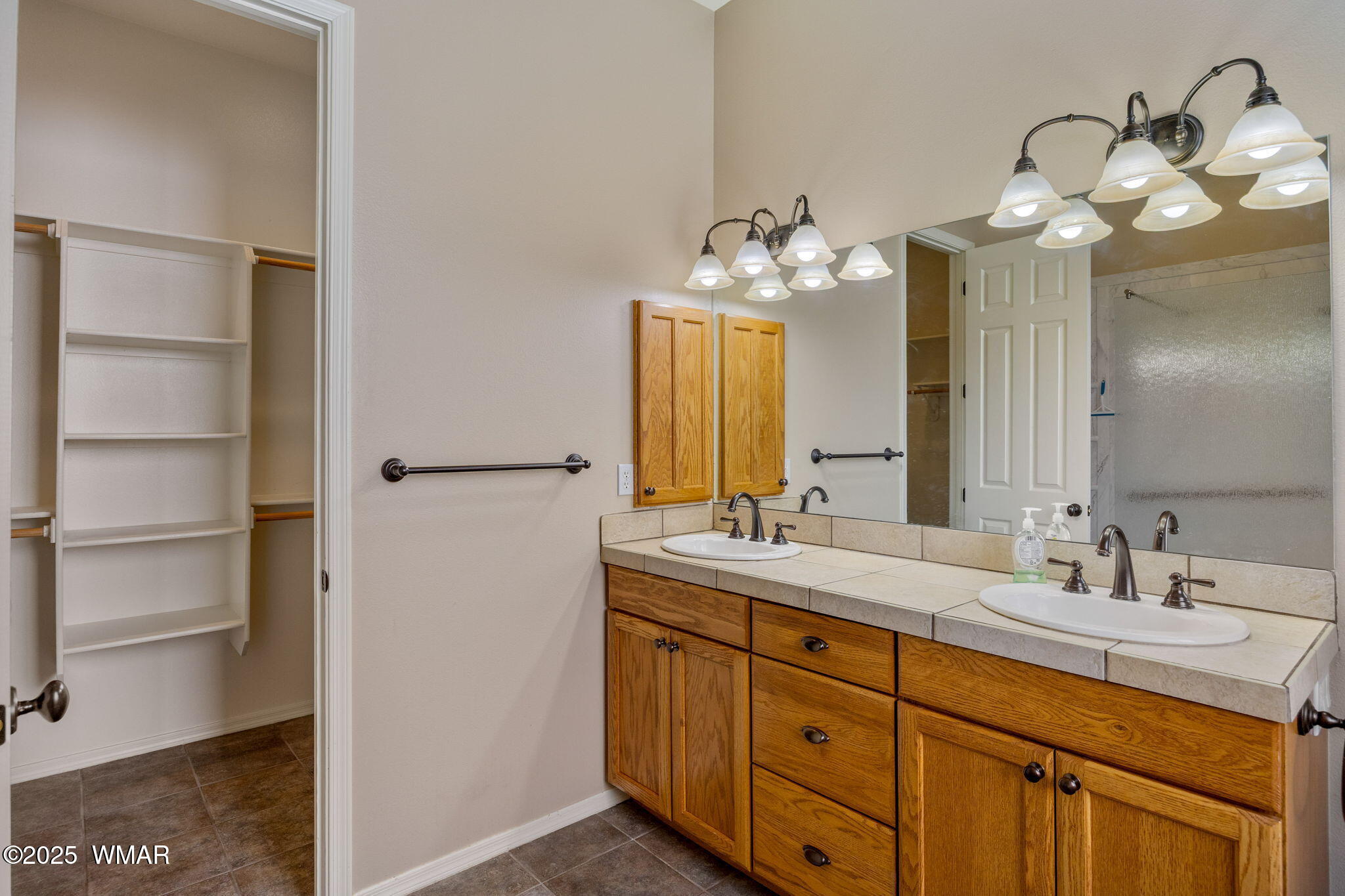 1058 East Adams Street Snowflake, AZ 85937 - Photo 8 of 37 a bathroom with a double vanity sink and a mirror