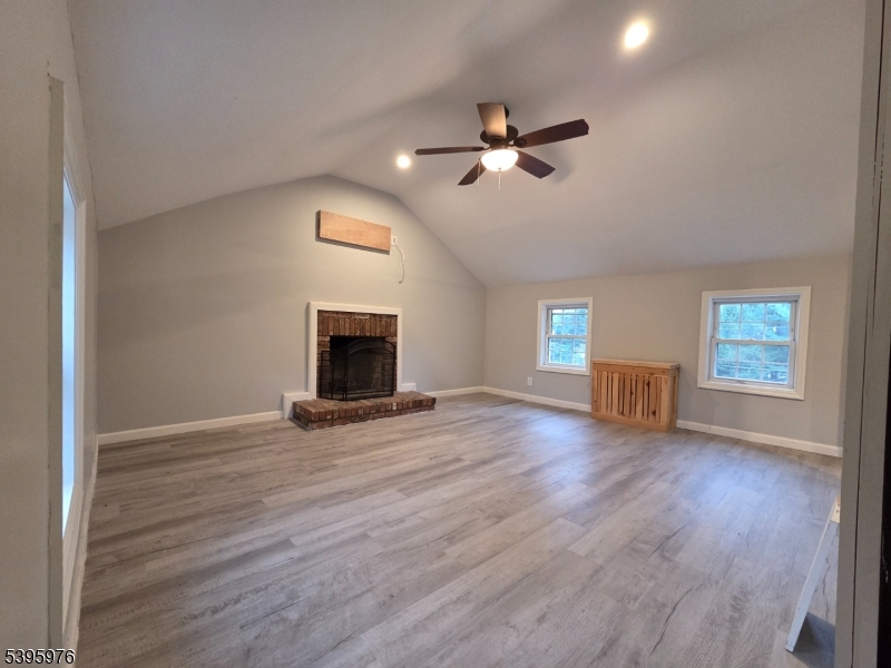 97 Fairmount Road East Califon, NJ 07830 - Photo 22 of 32 a view of empty room with wooden floor and fireplace