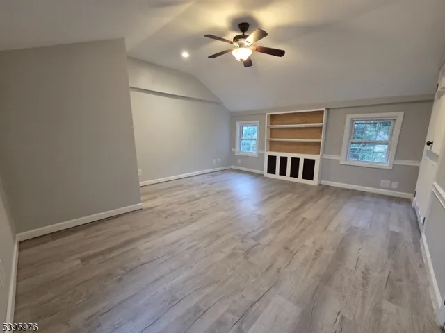 a view of livingroom with hardwood floor and ceiling fan
