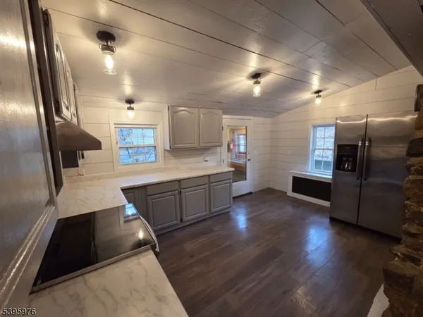 a kitchen with stainless steel appliances a refrigerator and a sink