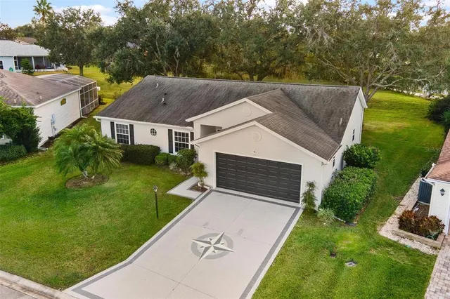 a view of house with a yard