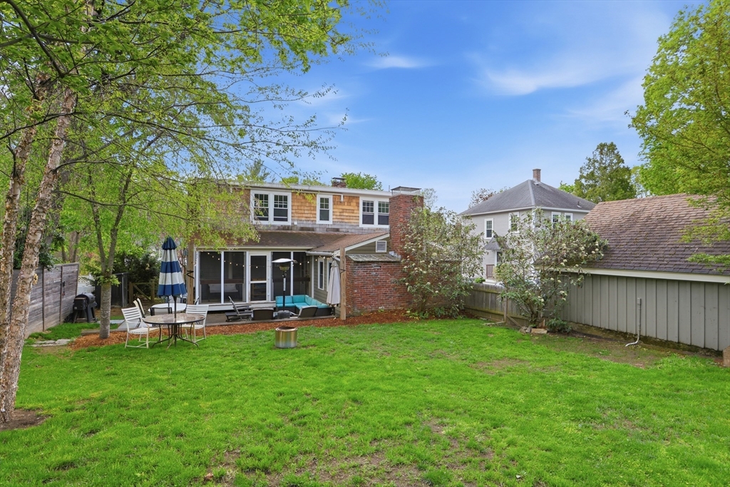 80 Concord Street Maynard, MA 01754 - Photo 27 of 29 a view of a house with a yard and sitting area