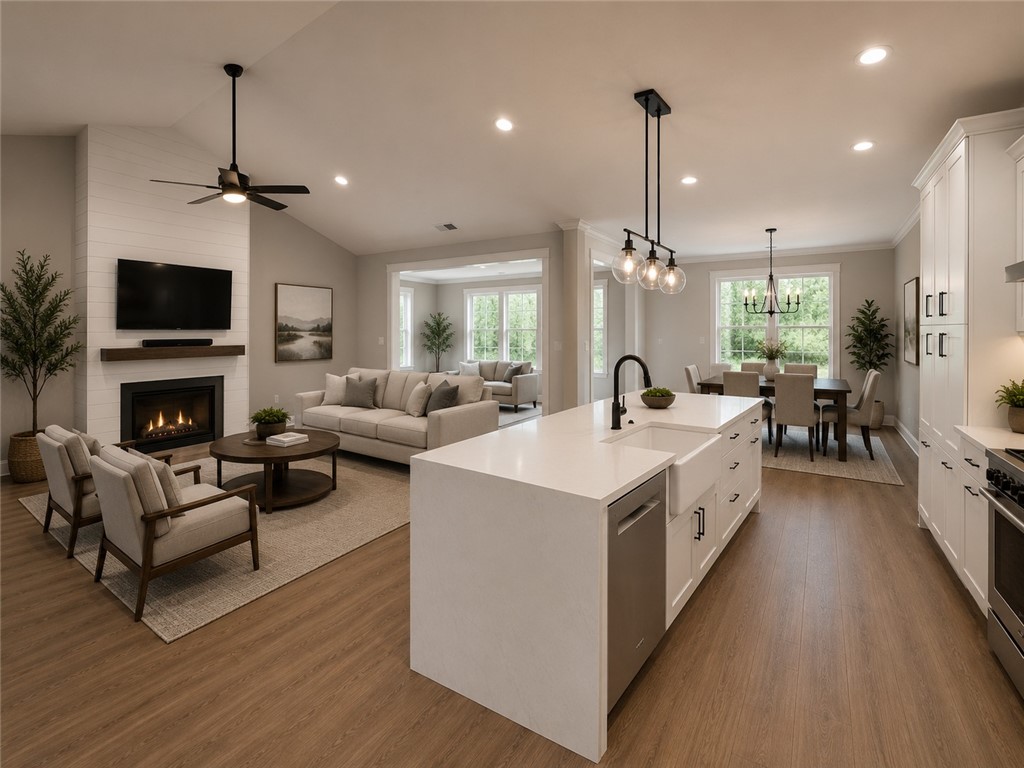 513 Quail Hollow Road Anderson, SC 29621 - Photo 12 of 39 This open concept living space features abundant natural light and seamless flow between living, dining, and kitchen areas.