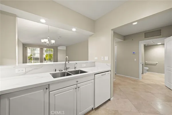 a bathroom with a sink and a large mirror