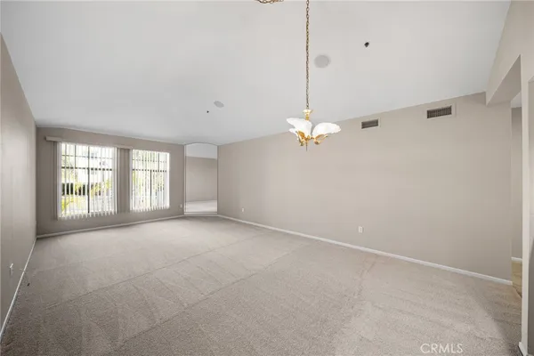 a view of empty room with windows