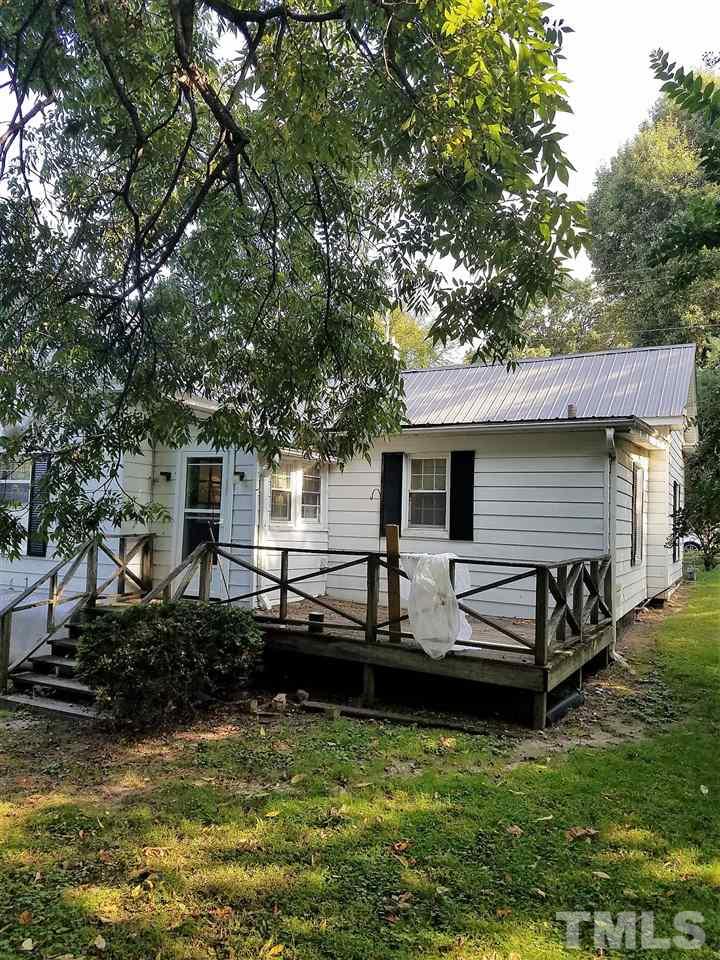25 Oak Street Roxboro, NC 27573 - Photo 13 of 14 a view of a house with backyard and sitting area