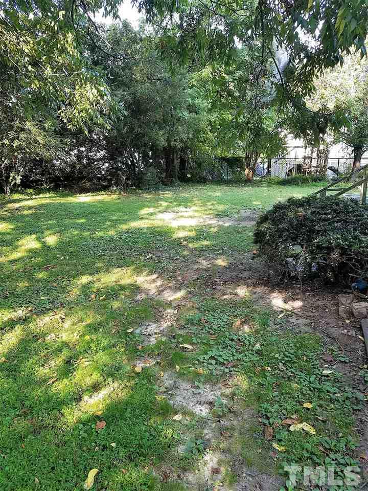 25 Oak Street Roxboro, NC 27573 - Photo 14 of 14 a view of a grassy field with trees