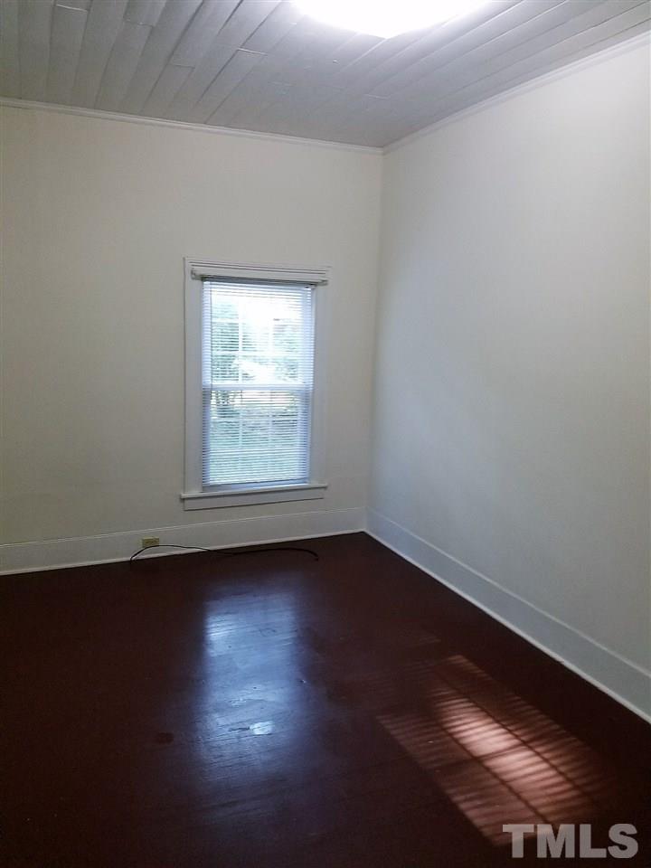 25 Oak Street Roxboro, NC 27573 - Photo 7 of 14 a view of room with hardwood floor and window