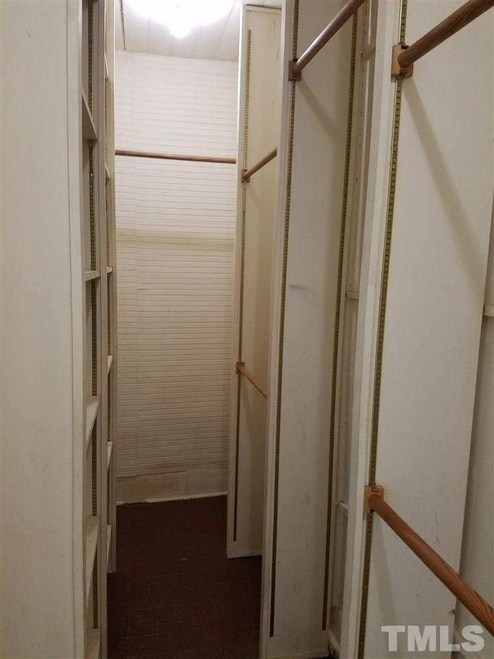 25 Oak Street Roxboro, NC 27573 - Photo 10 of 14 a bathroom with a glass shower door