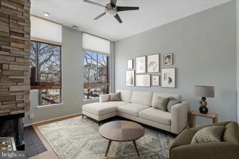 a living room with furniture and a window