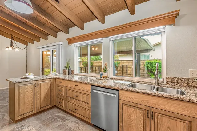 a kitchen with sink and window