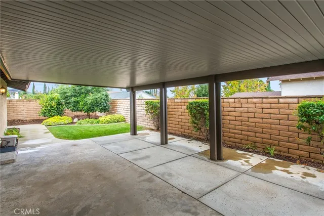 a view of a garden with an outdoor seating