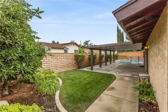 a view of a backyard with sitting area