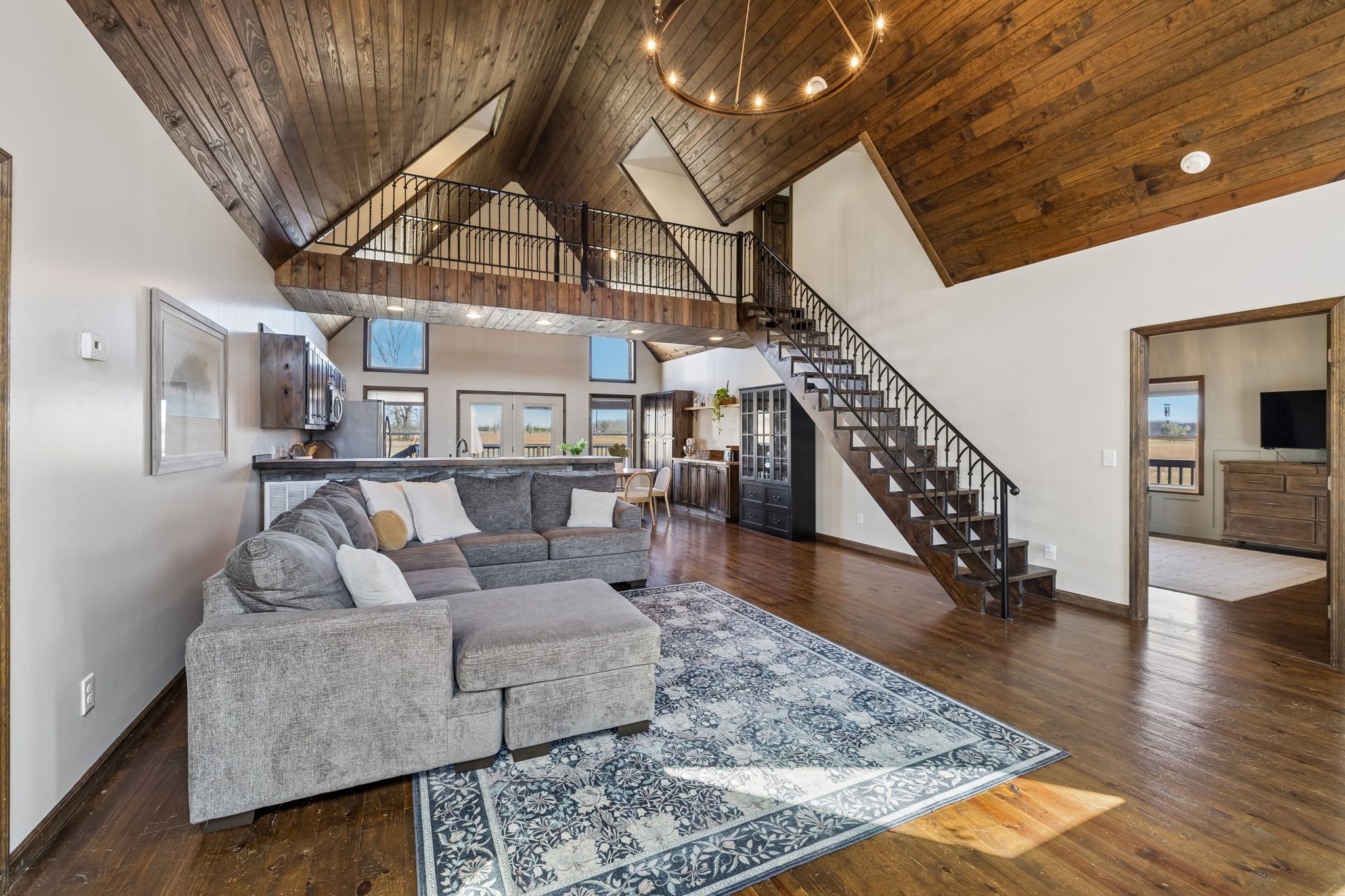 267 Switzerland Road Hohenwald, TN 38462 - Photo 32 of 98 a living room with furniture and wooden floor