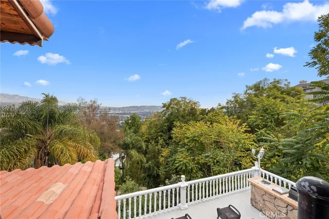 a view of entryway with a window and wooden floor