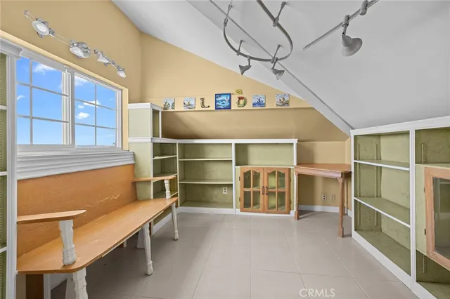 a bathroom with a sink a mirror and a shower