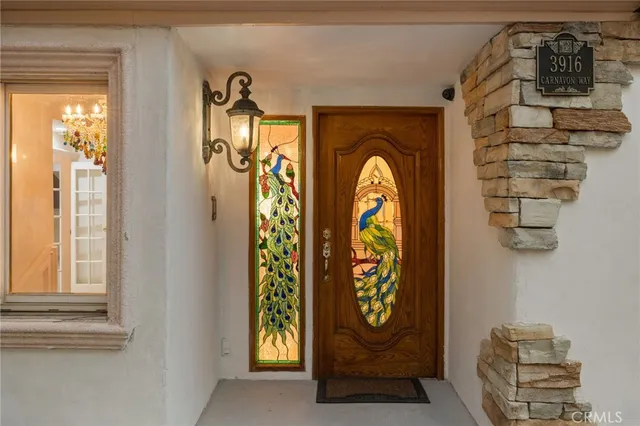 a front view of a house with iron fence