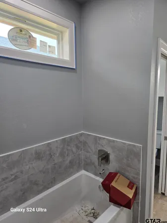 a bathroom with a bathtub