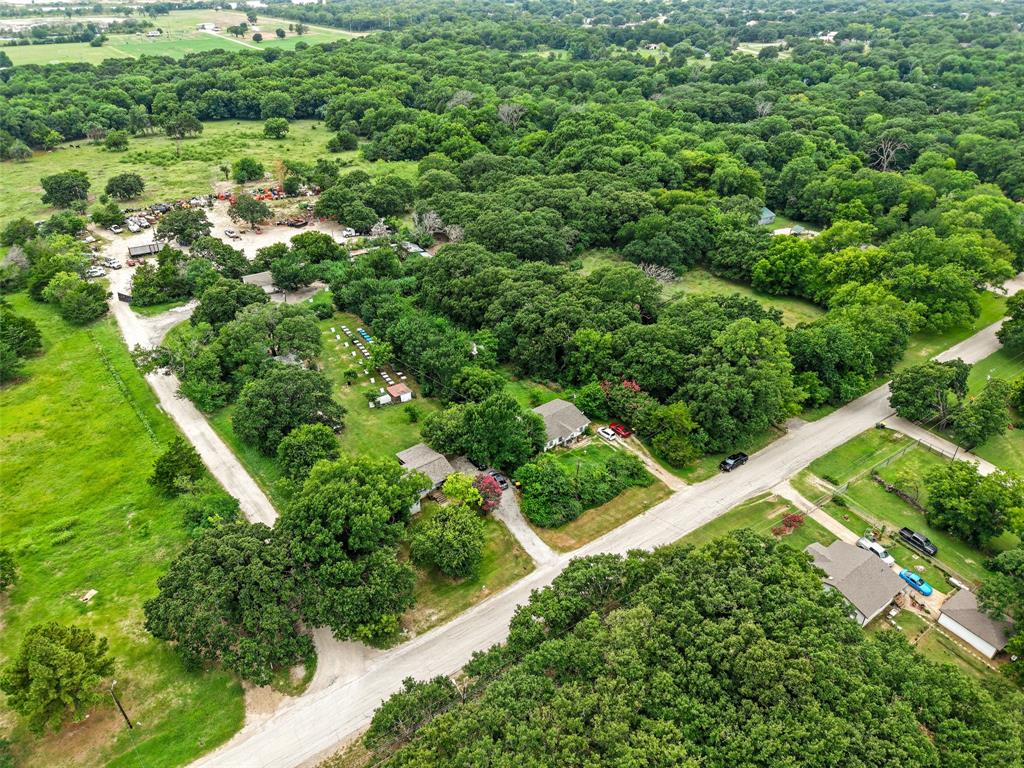 2503 Kleberg Road Seagoville, TX 75159 - Photo 5 of 10 Expansive wooded acreage with established roadways, multiple residential structures, and open green spaces