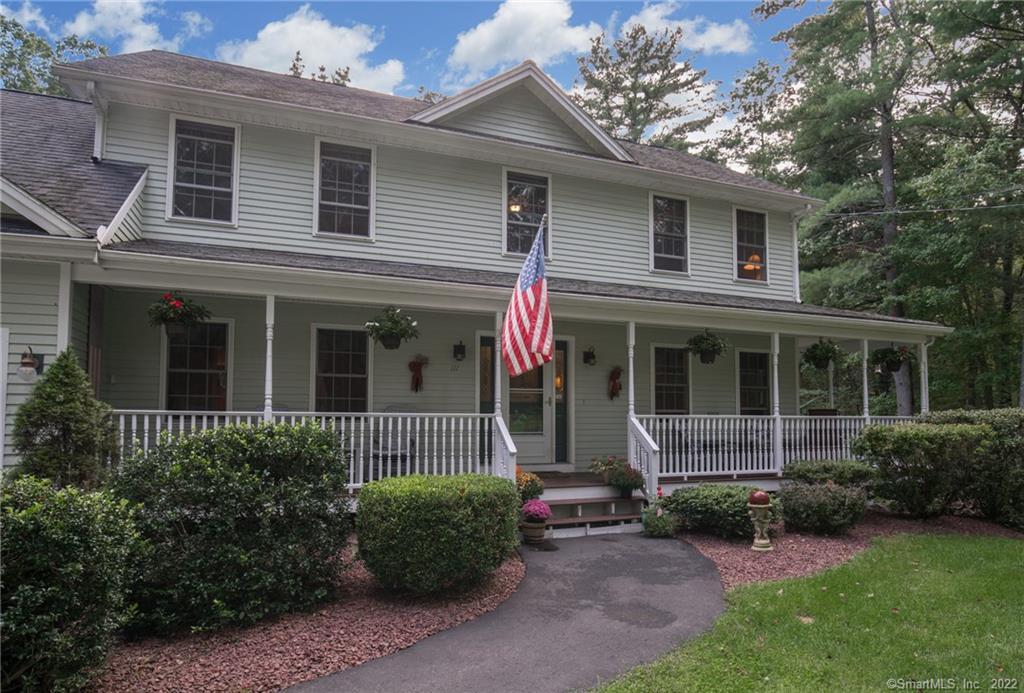 111 Stone Road Killingly, CT 06241 - Photo 1 of 1 a front view of a house with a garden