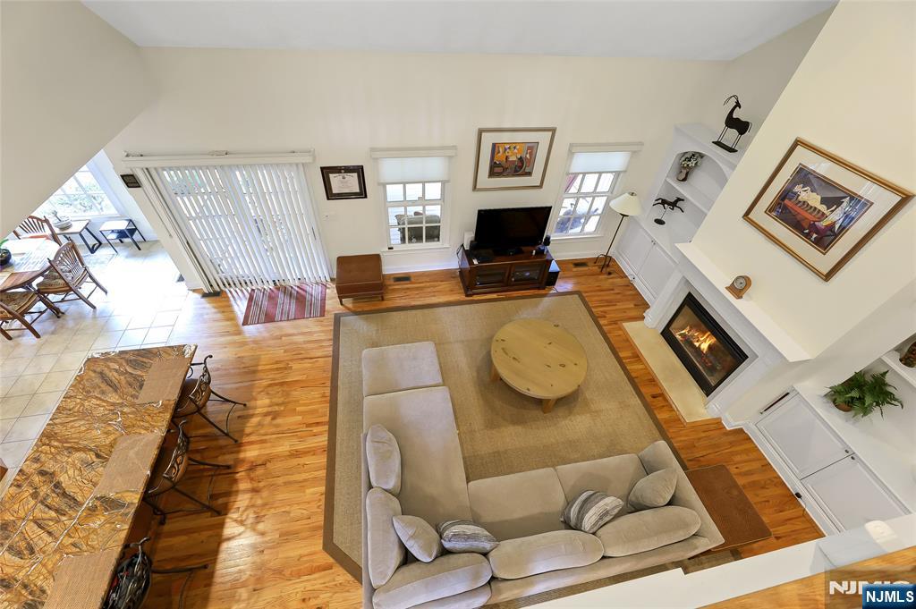 22 Meadowlake Drive Mahwah, NJ 07430 - Photo 26 of 39 a living room with furniture and a flat screen tv