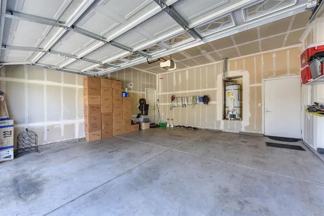 a view of empty room with air conditioner and window