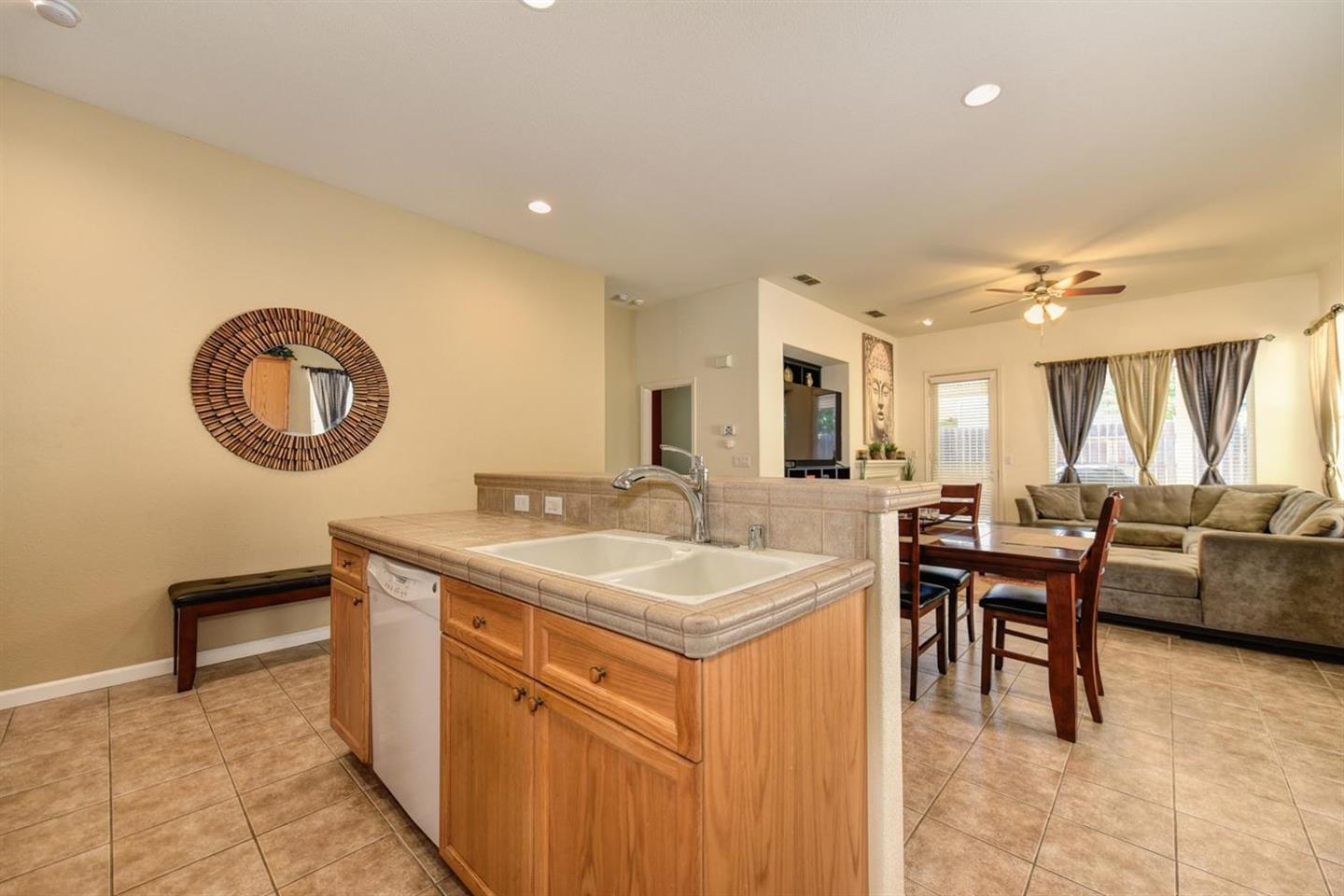3557 Rainsong Circle Rancho Cordova, CA 95670 - Photo 5 of 27 a view of a kitchen area with furniture and chandelier