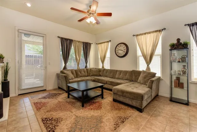 a living room with furniture and a window