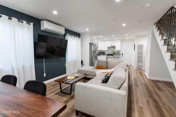 a bedroom with a bed and a potted plant