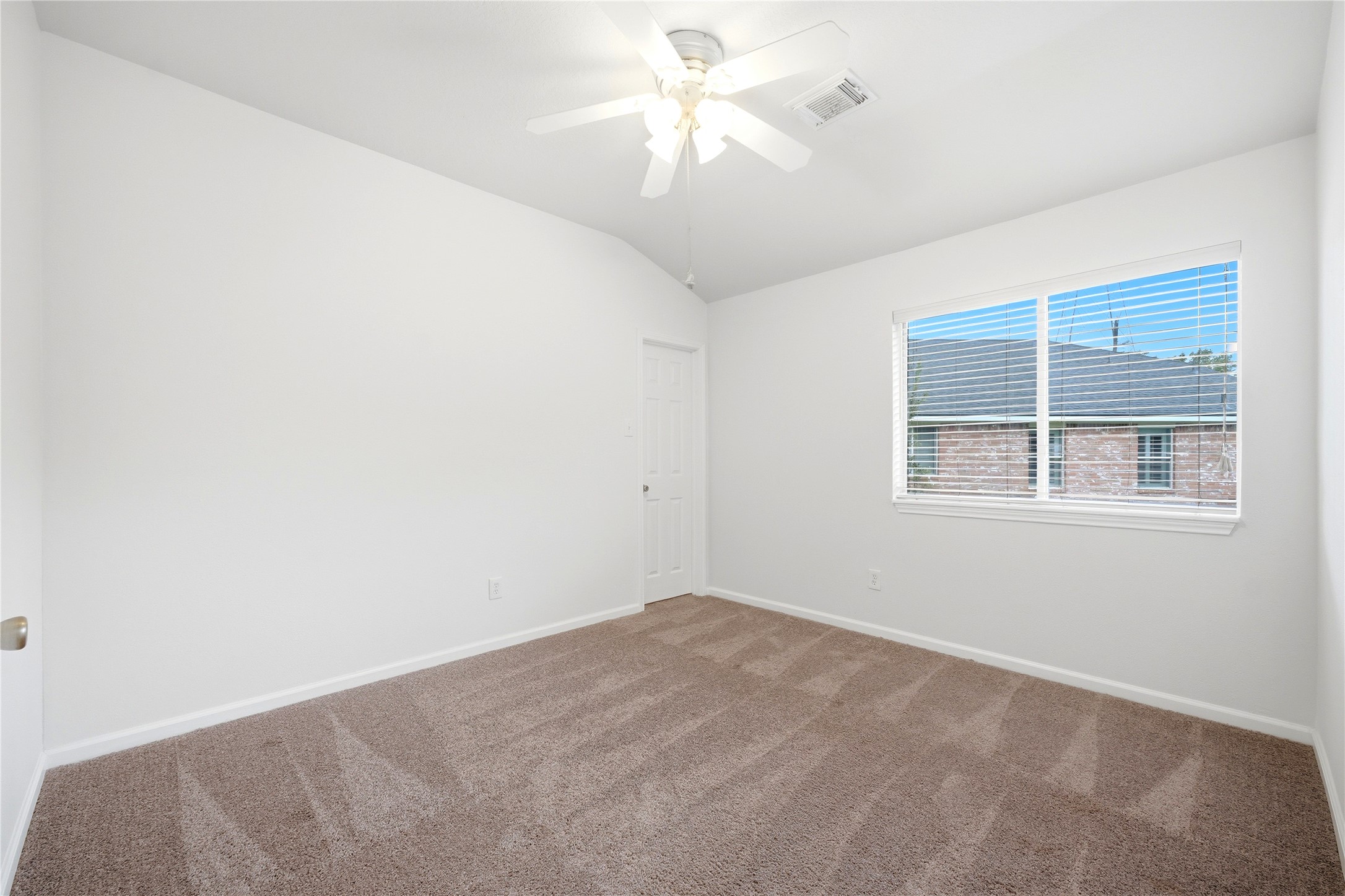 5411 Gate Canyon Court Spring, TX 77373 - Photo 28 of 33 a view of a room with a ceiling fan and a window