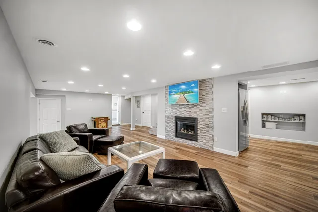 a living room with furniture and a fireplace