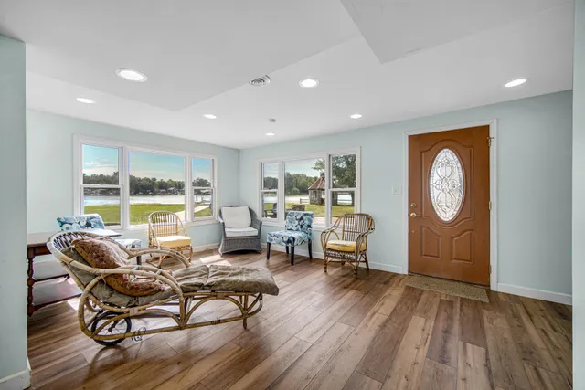 a living room with furniture a window and a table