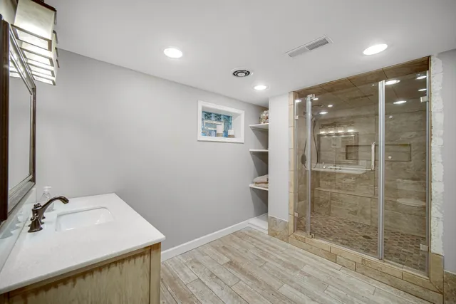 a bathroom with a sink and a mirror