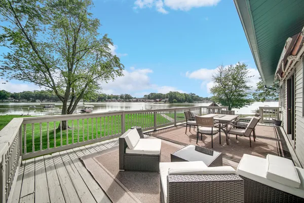 a view of a house with backyard sitting area and garden