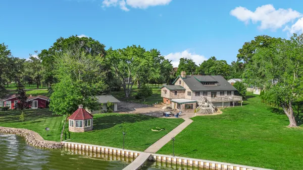 a view of a house with a yard porch and sitting area