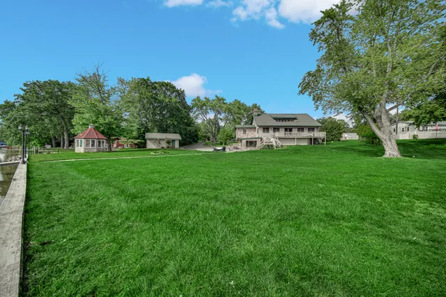 a view of a street with a houses in the background