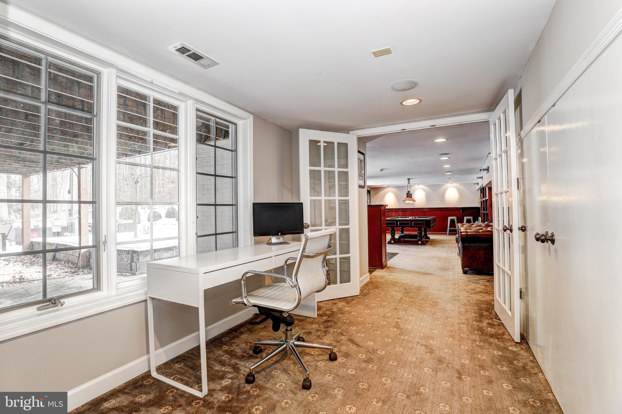 1021 Timber Trail Road Towson, MD 21286 - Photo 51 of 72 a view of a workspace with furniture and a window