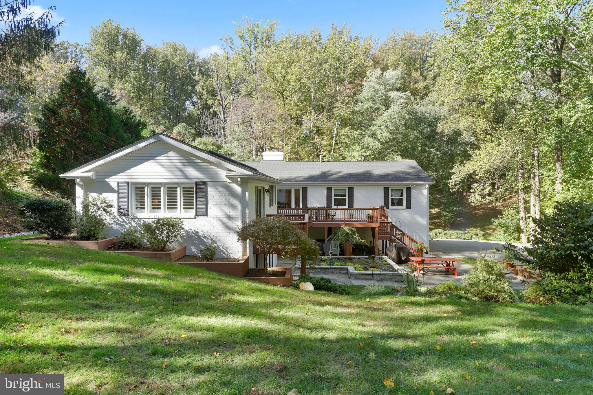 1021 Timber Trail Road Towson, MD 21286 - Photo 71 of 72 a front view of a house with a garden and trees